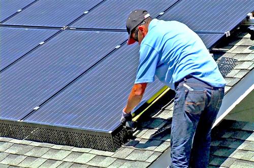 Man Installing Solatrim Solar Panel Protection