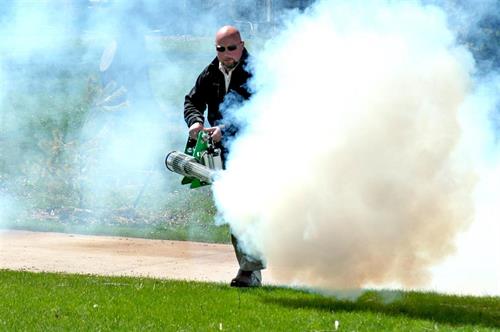 Person operating a fogging machine